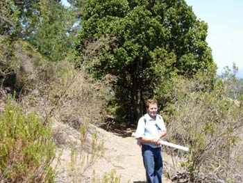 Frederico_on_trail_with_maps